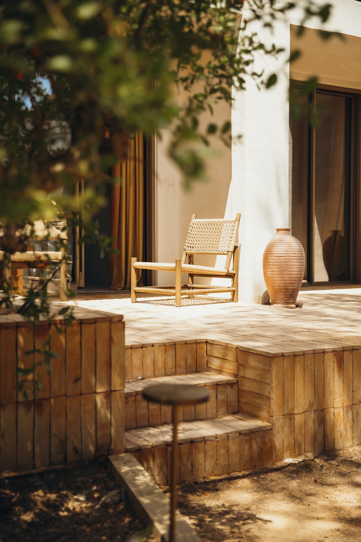 teracotta, clay and wood on terrace at Nomade Temple