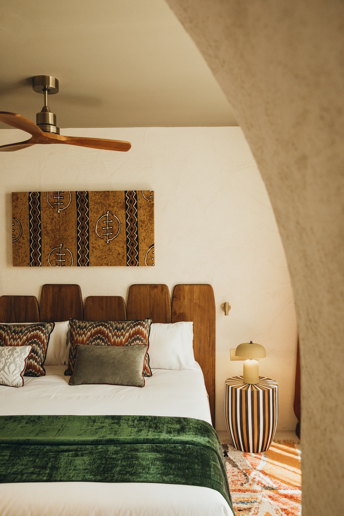view throug curved archway into guestroom