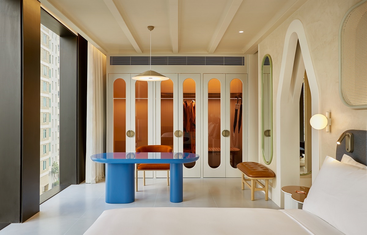 blue table in front of backlit wardrobe in The Standard guestroom