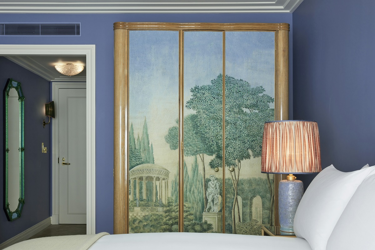 blue guestroom with handpainted wardrobe