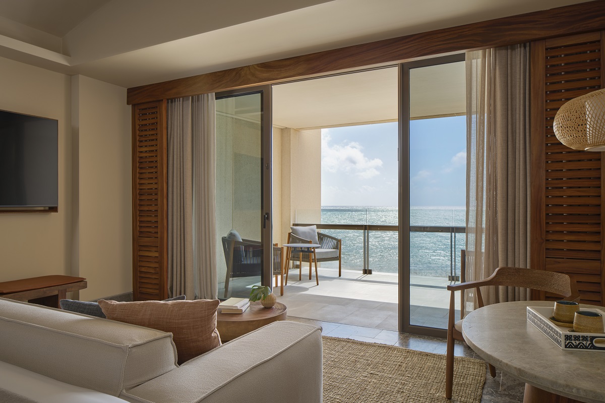 seating in hotel suite leading on to private terrace with sea view