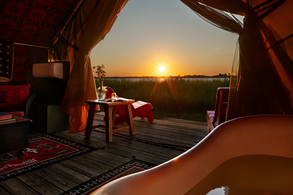 sunset from the vintage bath in Urban Cowboy glamping tent
