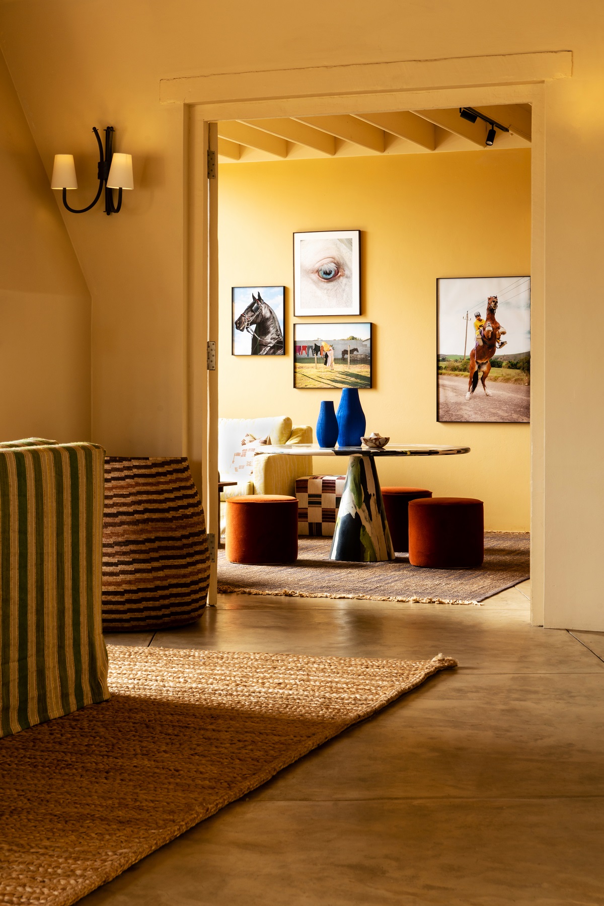 yellow walls and natural floors in hallway of hotel