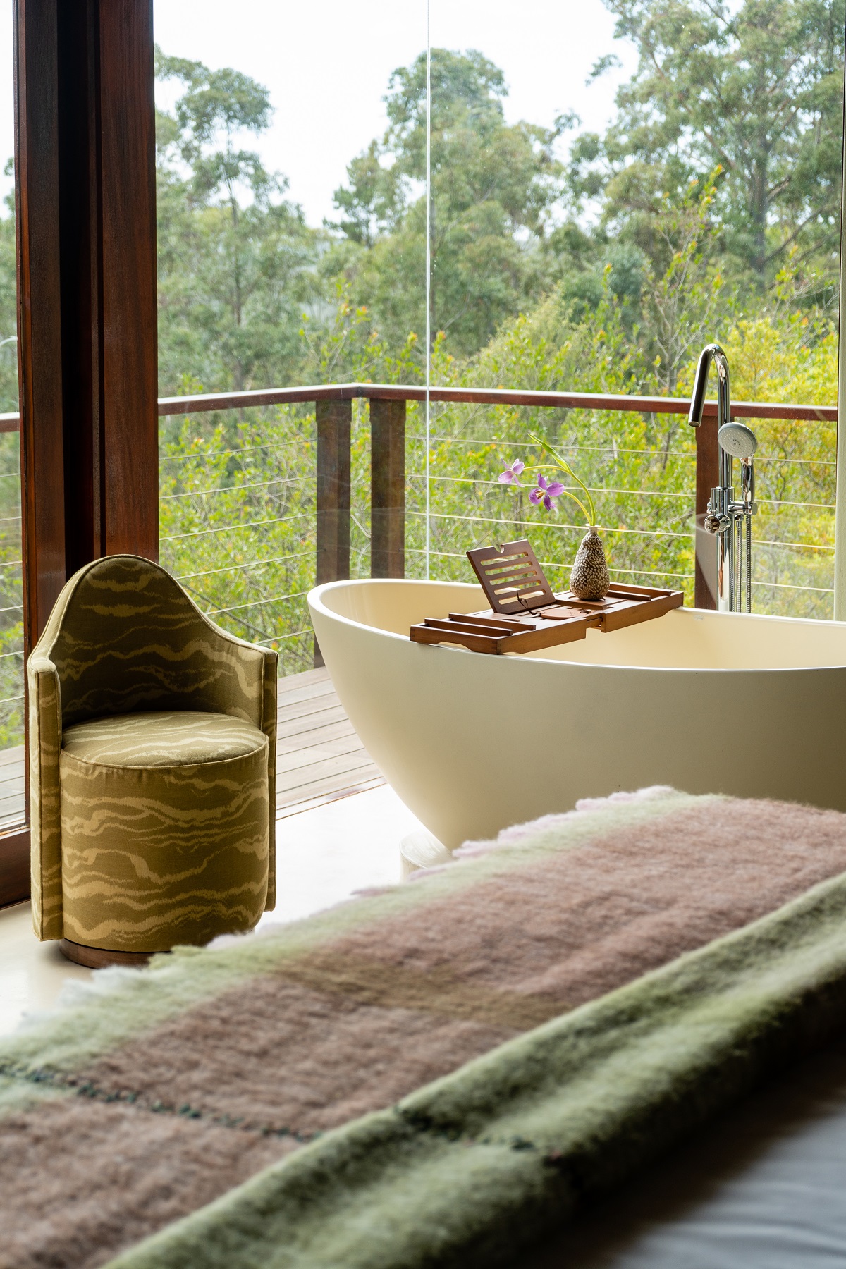 freestanding open air bath on terrace next to bed