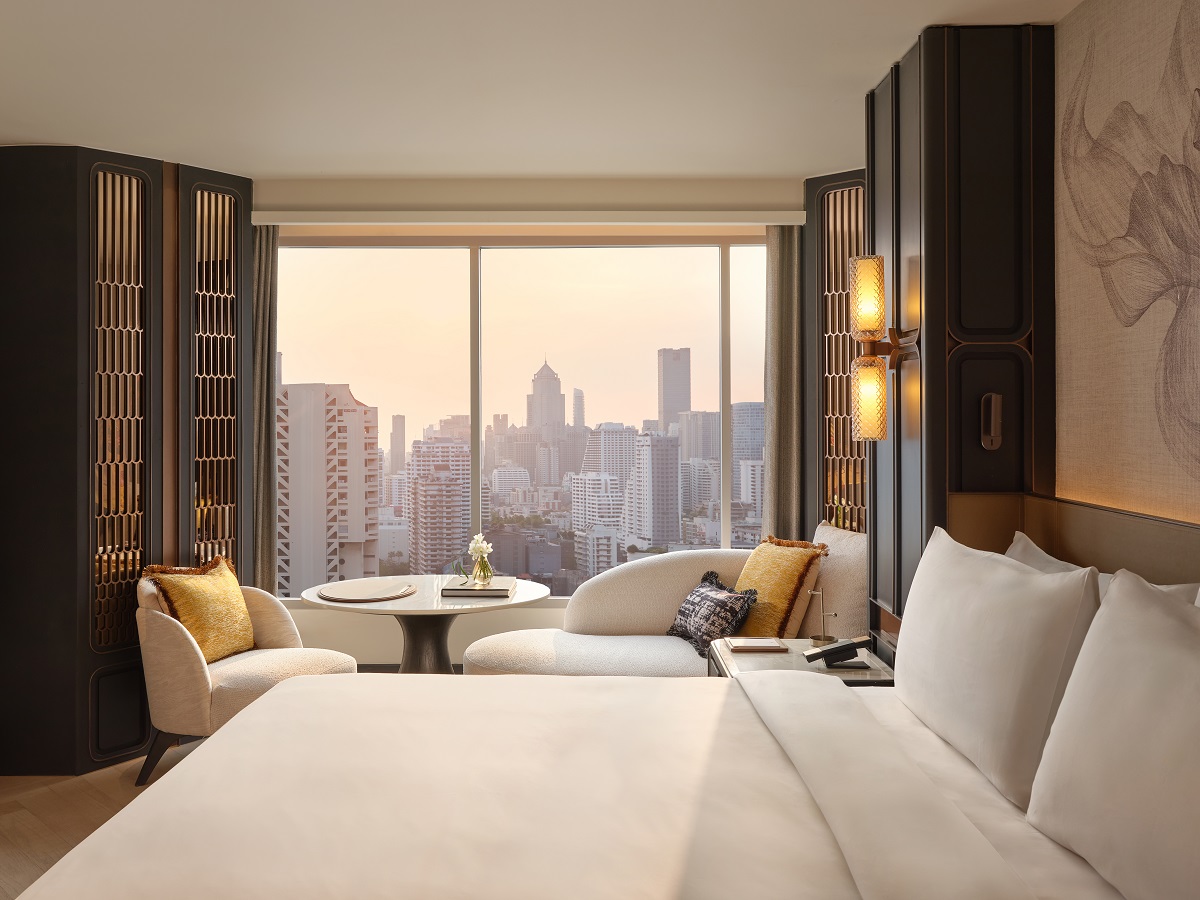 Fairmonht Bangkok view from bed across seating to windows with city view