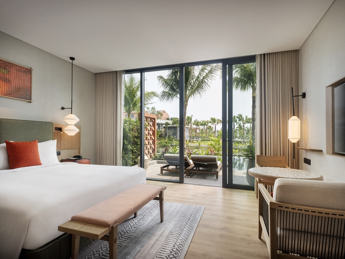 guestroom opening on to terrace overlooking river and gardens