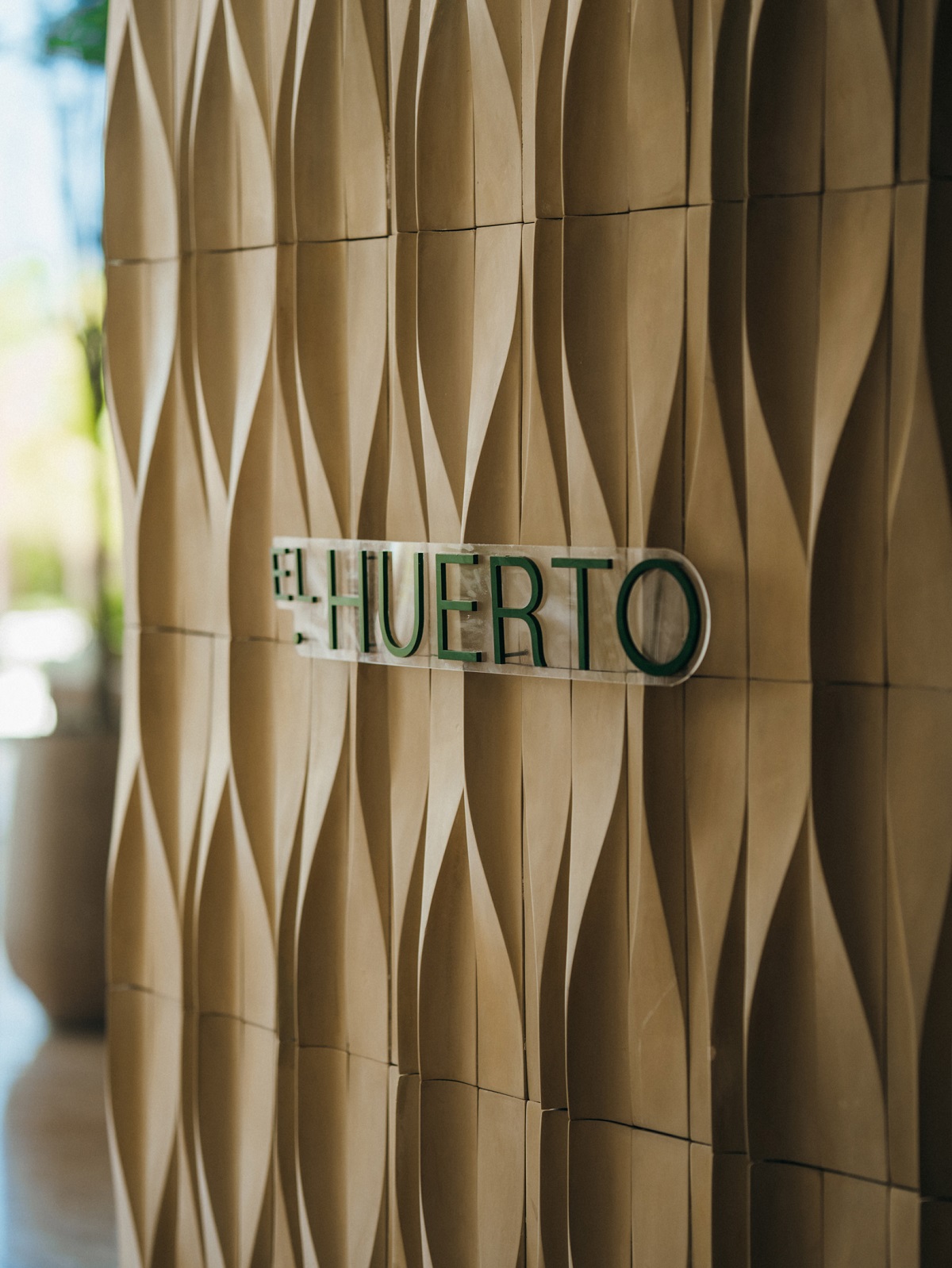 textured wall at entrance to el Huerto restaurant