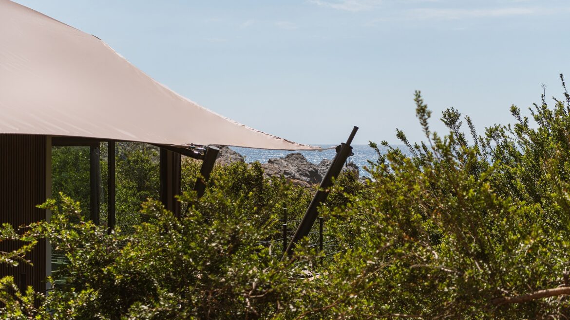 external view of landscape and tented cabin at The Revery