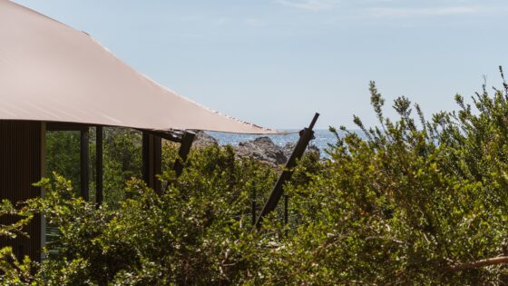 external view of landscape and tented cabin at The Revery