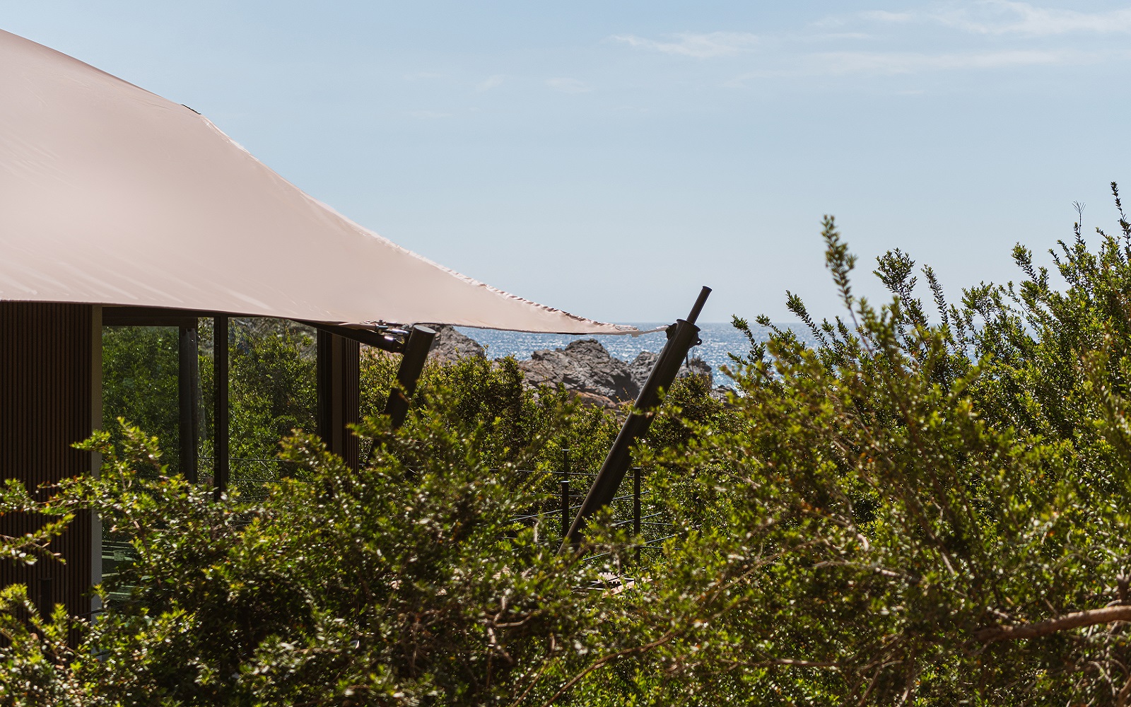 external view of landscape and tented cabin at The Revery