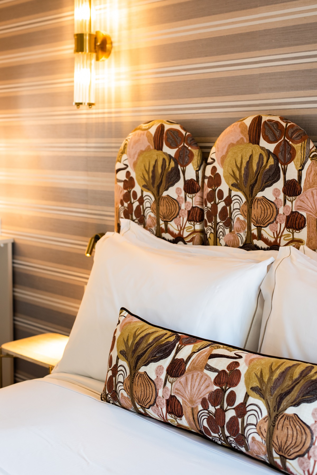 floral upholstered headboard detail in villa dorothea