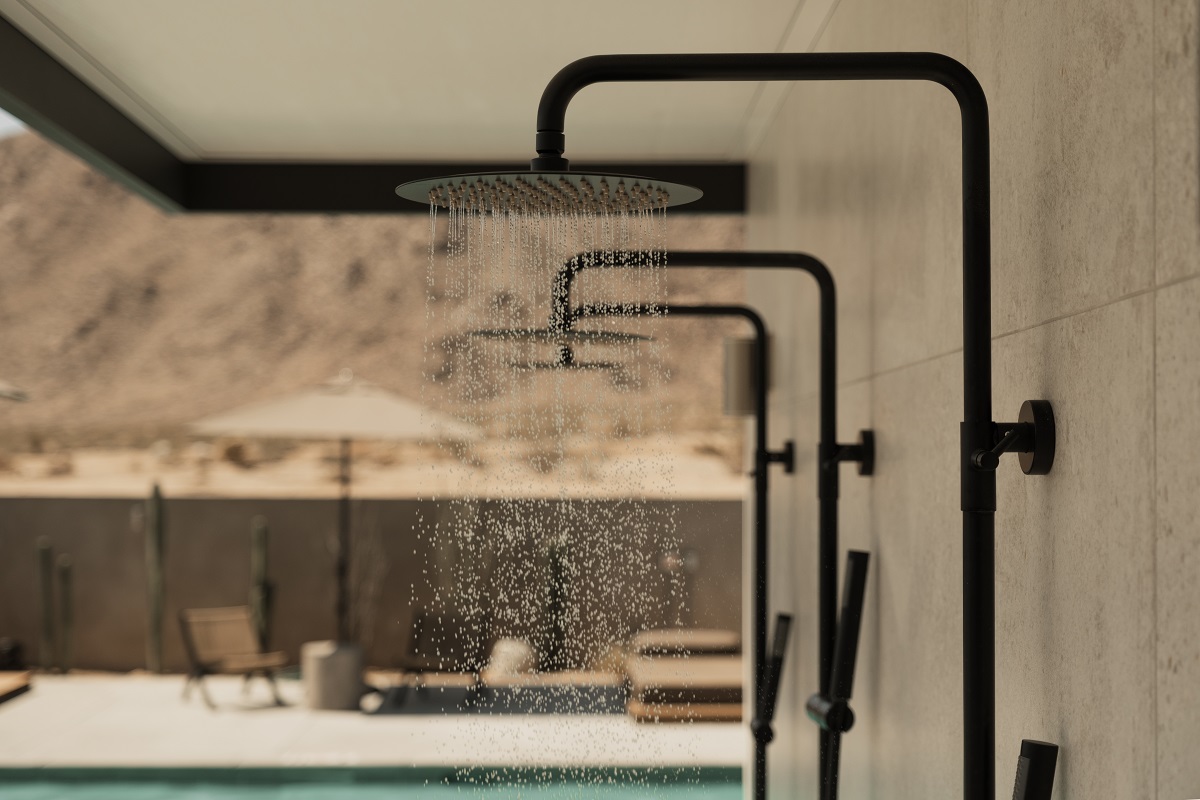 view from shower at RESET Hotel to outdoor pool and Joshua Tree location