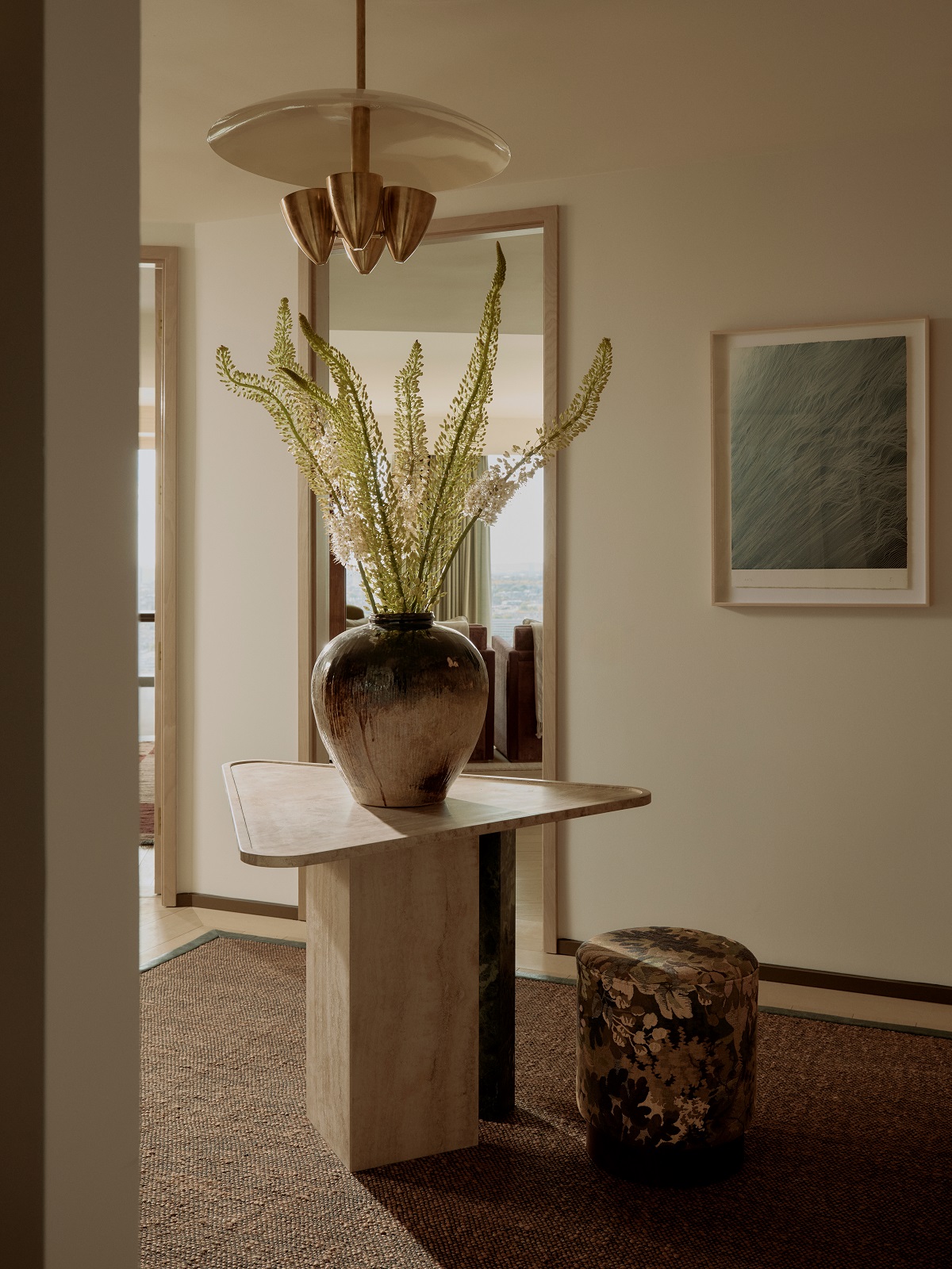 triangular table in entrance hall of apartment - bespoke design