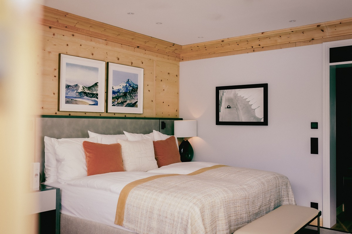 art in kulm hotel guestroom on pine panelled wall - curated by Artiq