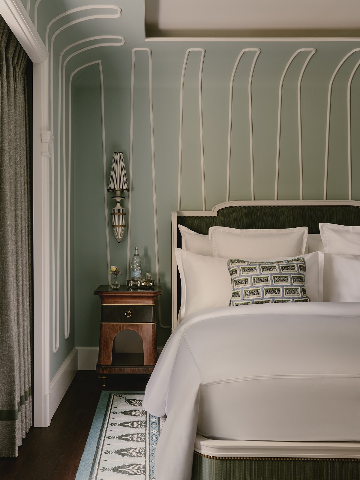 guestroom detail with bed below curved panelled ceiling