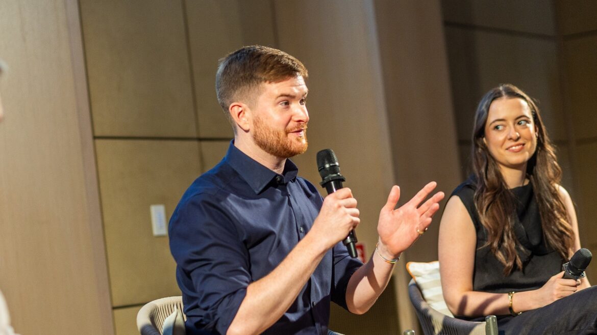 artiq on stage discussing art in hotels