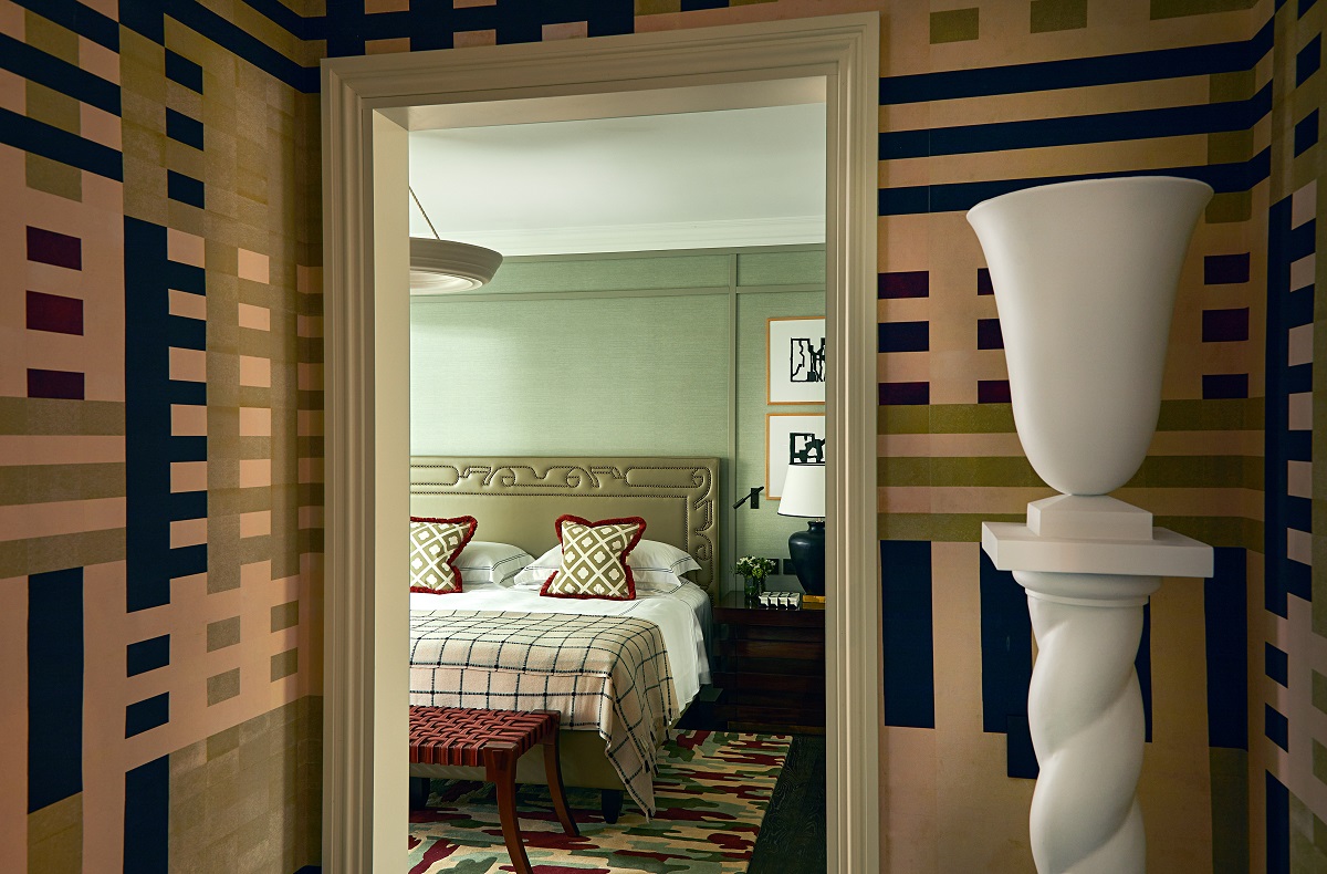 bold striped wallcovering and white decorative urn at bedroom doorway in The Carlton Rocco Forte