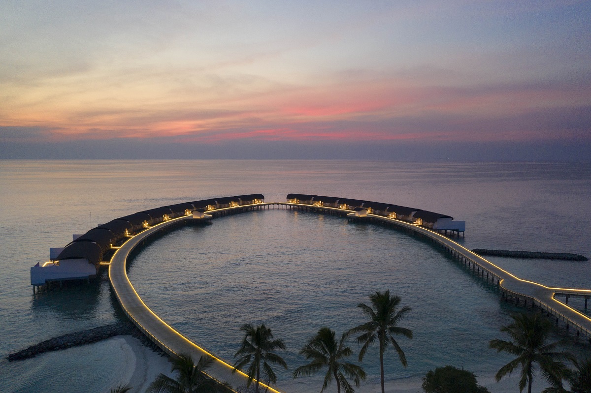 sunset aerial view of The Westin Maldives Miriandhoo Resort