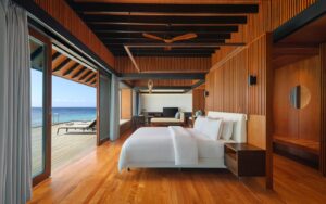 bed looking out to sea in The Westin Maldives Miriandhoo Resort