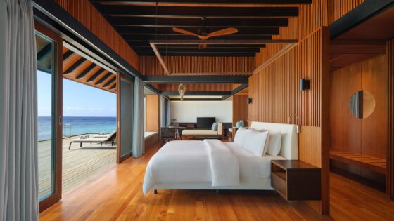 bed looking out to sea in The Westin Maldives Miriandhoo Resort