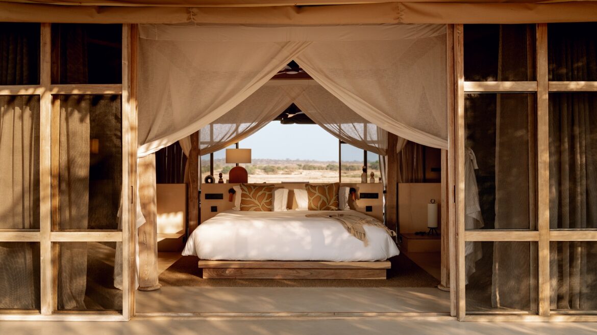view of bed in tented guestroom at Ubuyu from Banyan Group