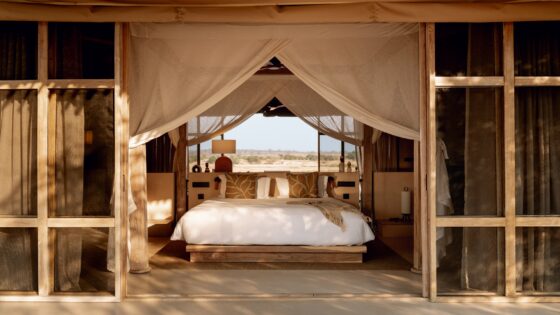 view of bed in tented guestroom at Ubuyu from Banyan Group