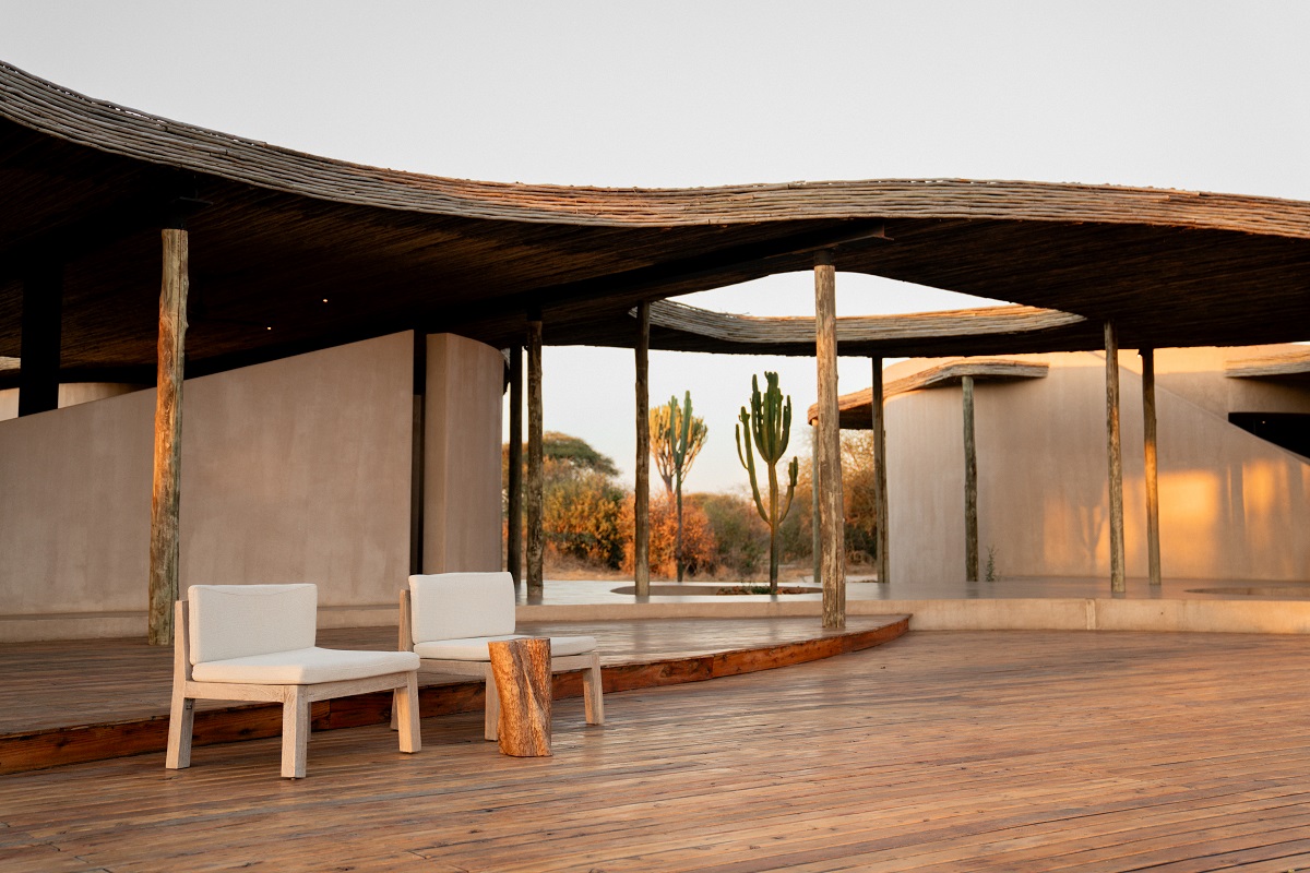 wooden deck with curved roof at Ubuyu Private Retreat