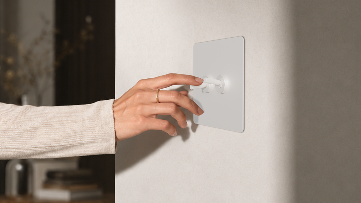 hand on repenic switch in hotel guestroom