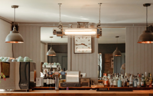 vintage lighting from Loomlight over retro bar and coffee station photo credit @suiehuntinglodge