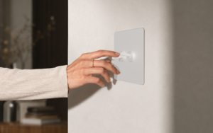 hand on repenic switch in hotel guestroom