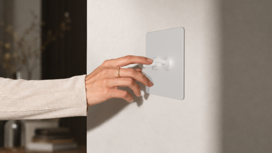 hand on repenic switch in hotel guestroom
