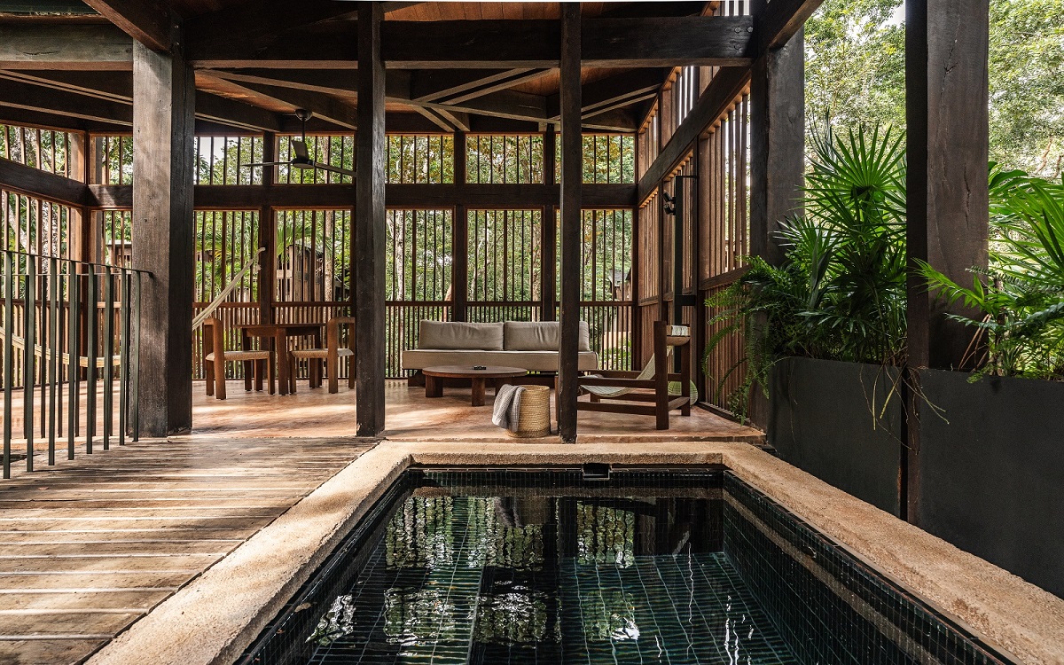 indoor pool amongst tropical foliage