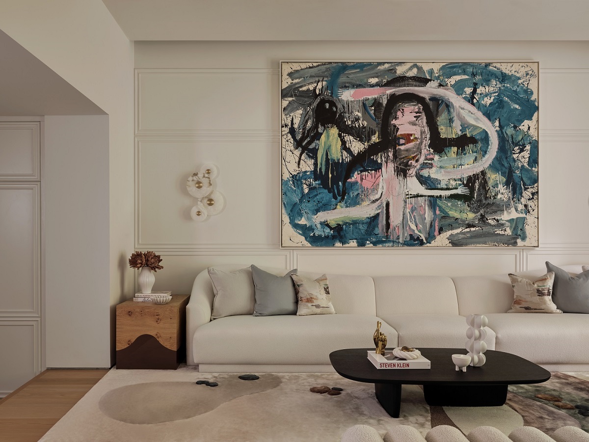 white wall with large abstract painting in blues in /airlie gardens by /Taylor Howes