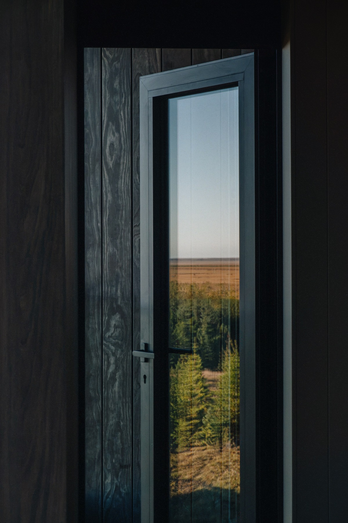 exterior of window with reflection of Icelandic landscape