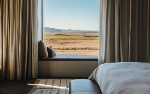bed and window seat with panoramic icelandic view in 360 Hotel