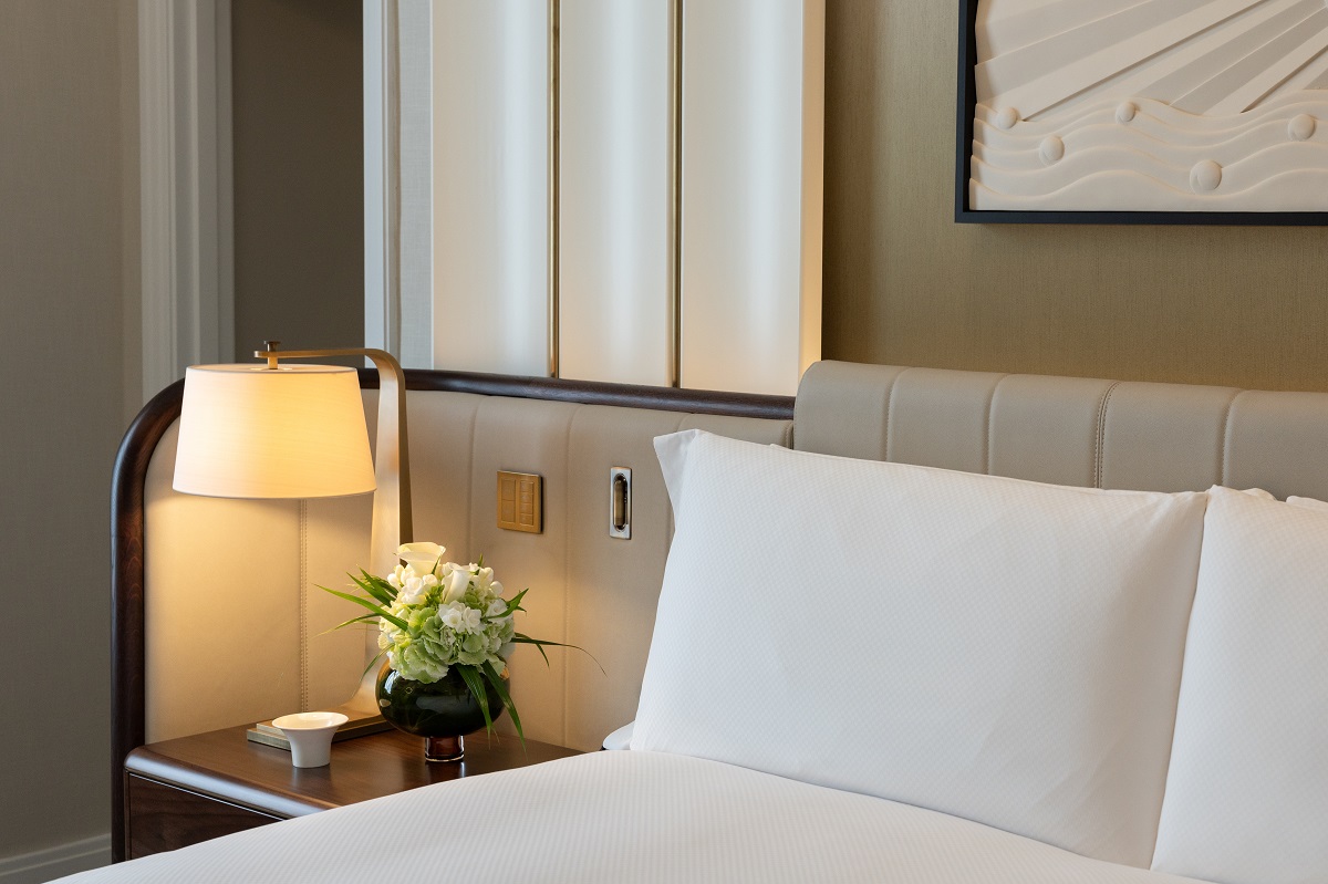bedside light and bed detail in guestroom of The Savoy London