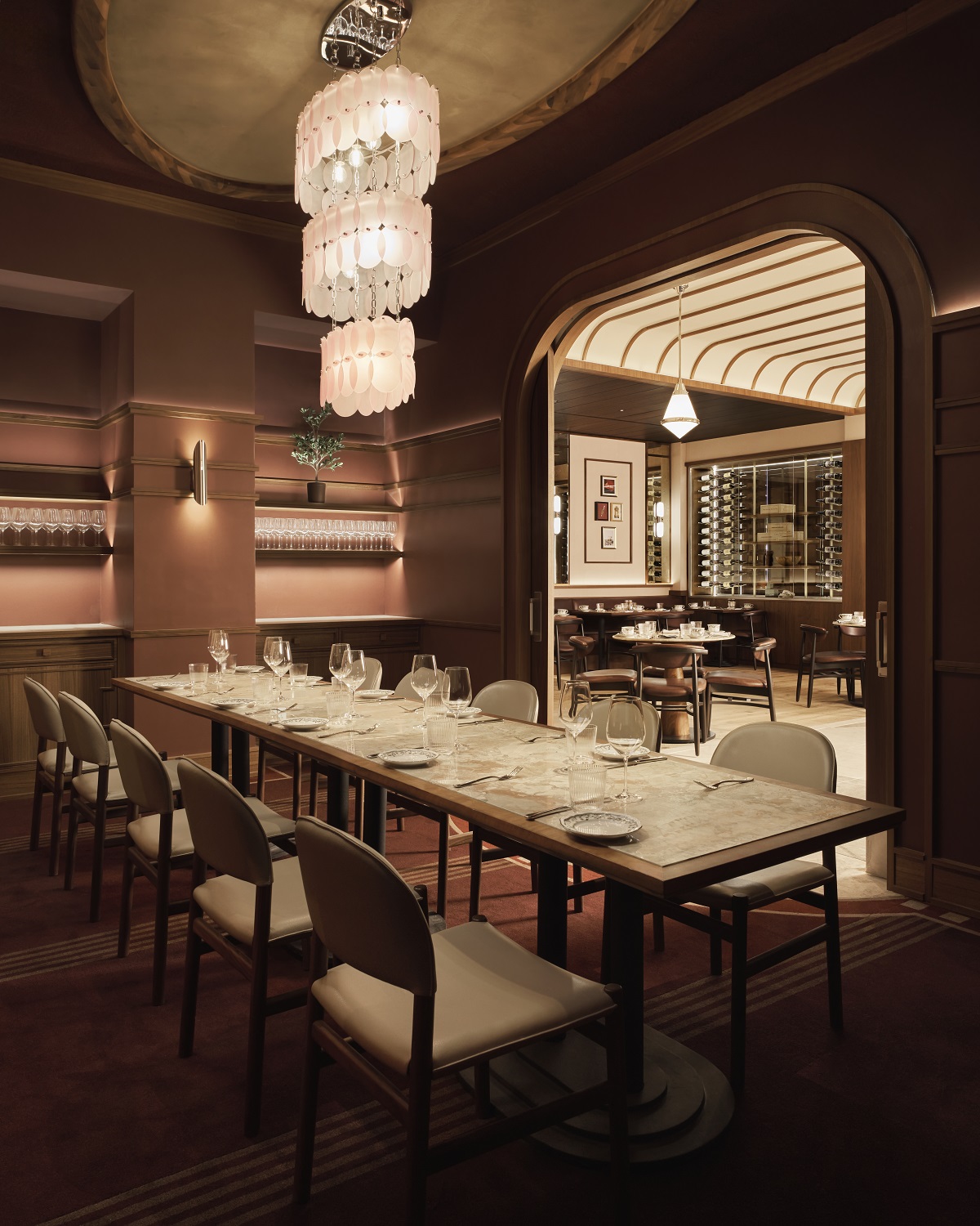 private dining room in hotel alcove with long table and chandelier