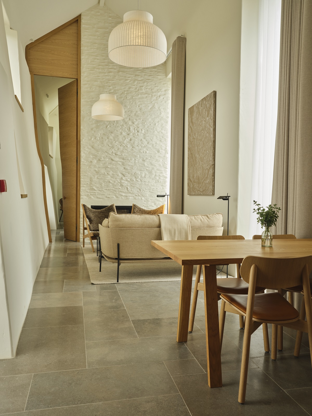 whitewashed walls, wood table and stone floor in Fowlescombe Farm