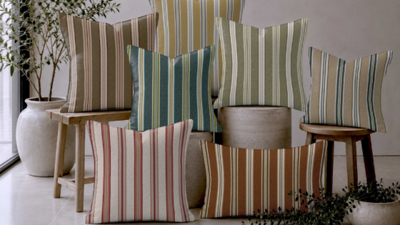 a pile of striped cushions in Poole stripe from Skopos