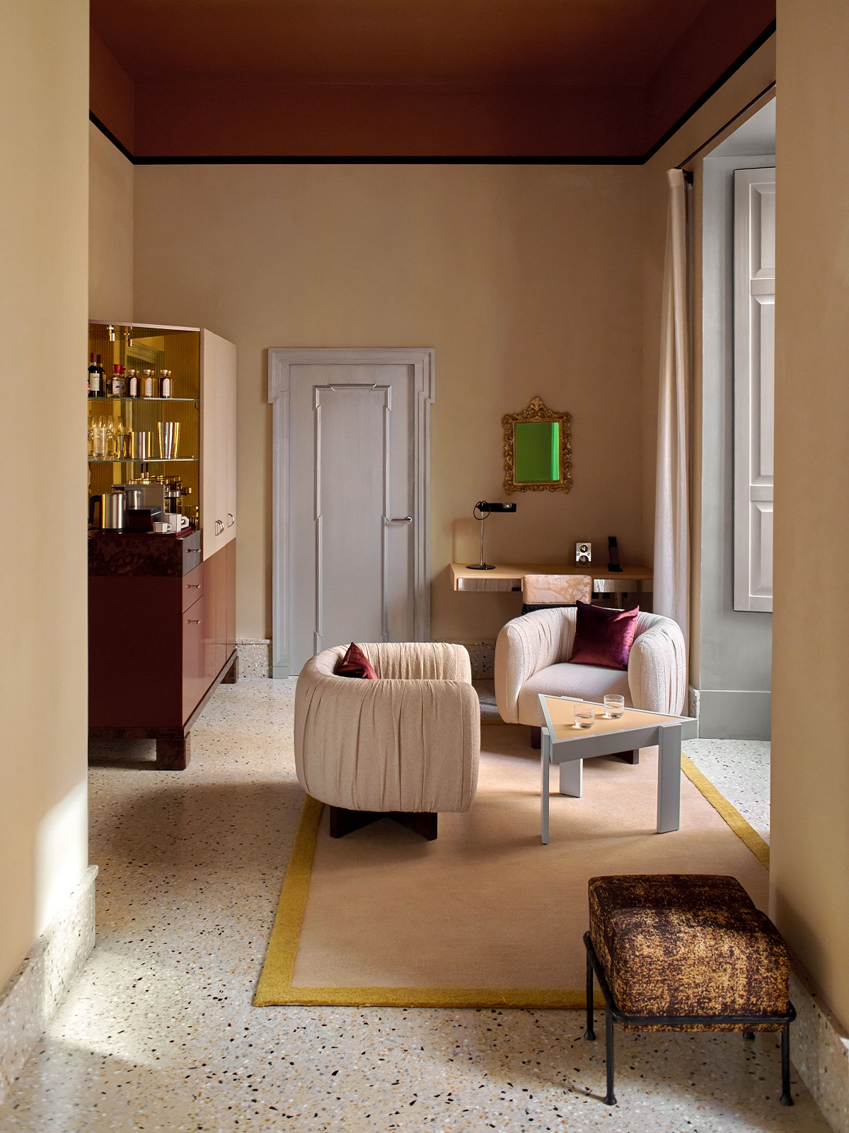 corner of guestroom with chairs in front of window