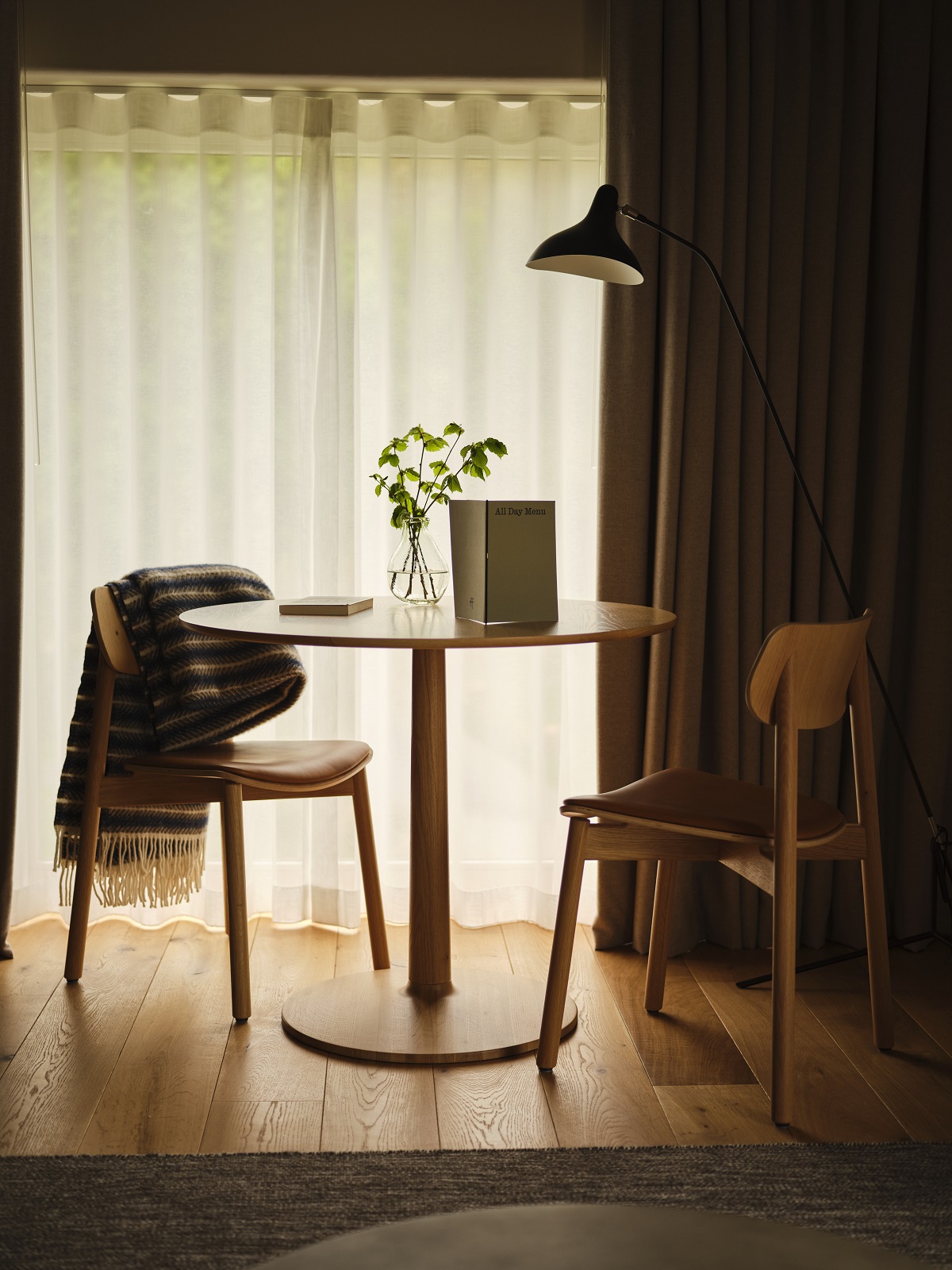 table and chair in corner of a room at Fowlescombe Farm