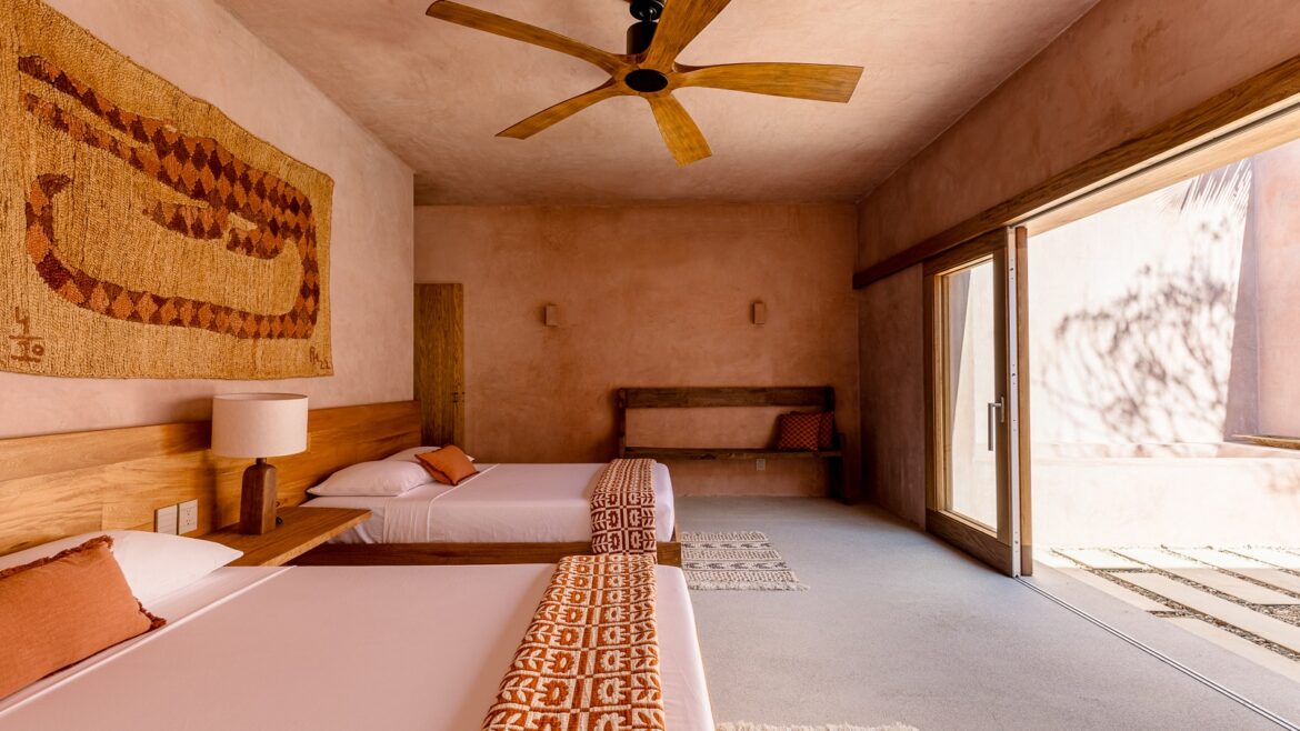 earthy tones, wooden fan, woven wallhanging in Casa Coco