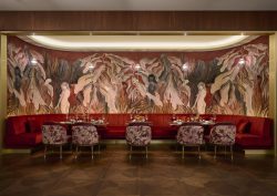 Arte wallcovering in statement wall behind banquette seating in hilton lobby