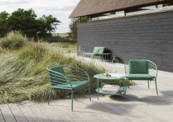 green outdoor BoConcept furniture on wood deck
