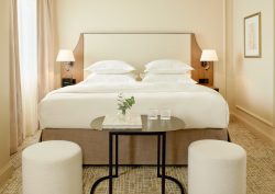 art deco influences in shades of white and cream in first guestroom at villa dahlia