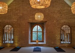 exposed brick, natural woven lampshades and period window features in grain store renovation by sparcstudio