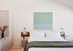 double bed with throw in guestroom at The three ducks hotel