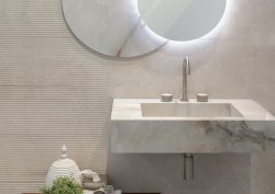 marble bathroom sink with mirror and stone wall in alpine from Bagnodesign