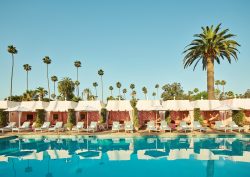 the cabanas around the pool at the Beverly Hills Hotel Cabanas by Champalimaud Design