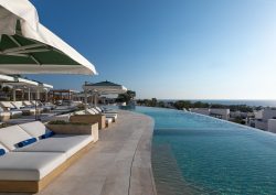 sunloungers and infinity pool at Sandblu resort Santorini